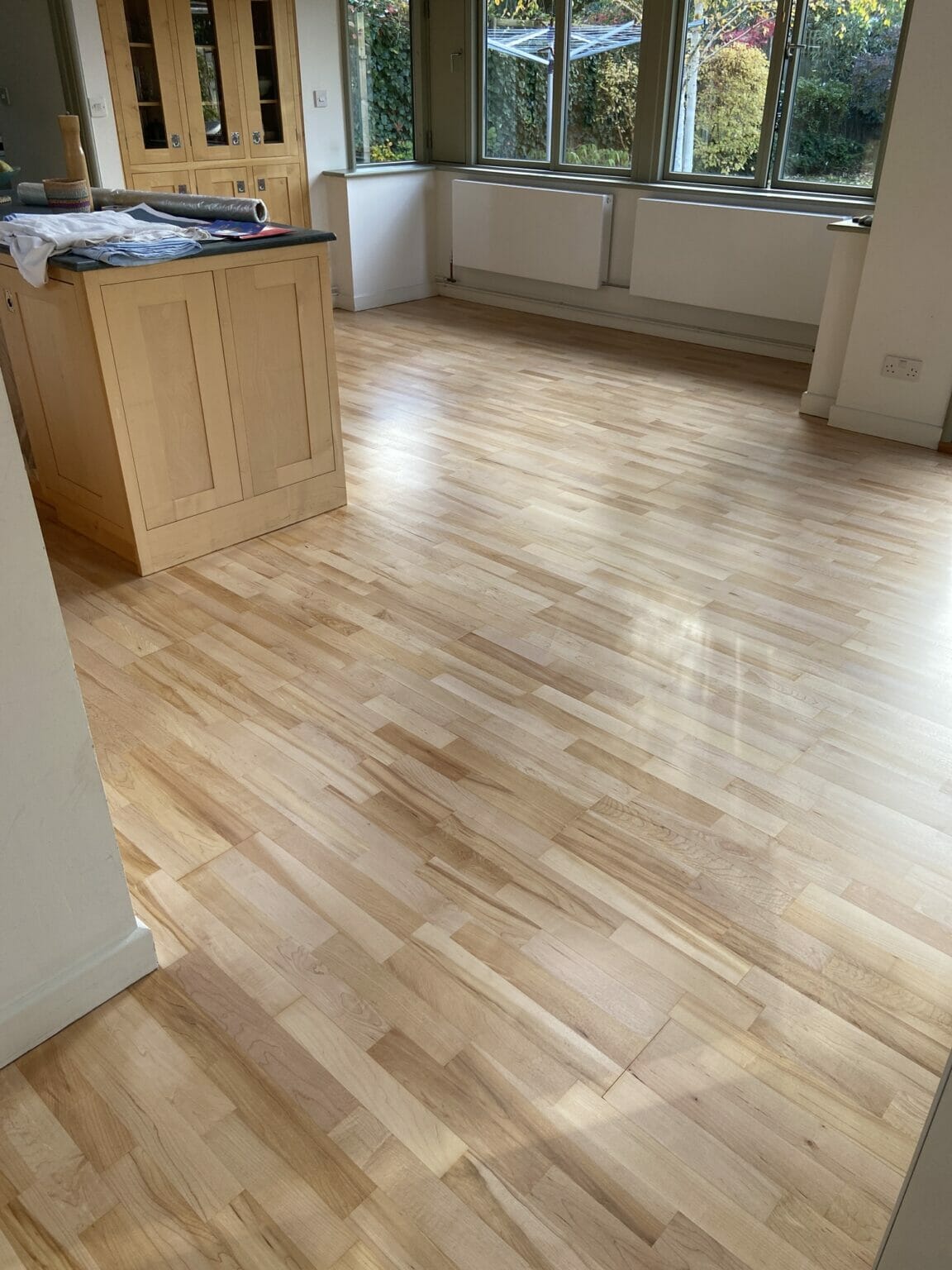 How can I refinish my wood floors without sanding?