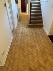 CB28AF floor sanding Cambridge art of clean restored wood floor in hallway 